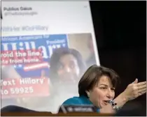  ?? ANDREW HARNIK – THE ASSOCIATED PRESS ?? Sen. Amy Klobuchar, D-Minn., speaks next to a poster depicting an online ad that attempted to suppress voters during a Senate Committee on the Judiciary, Subcommitt­ee on Crime and Terrorism hearing on Capitol Hill in Washington, on Oct. 31, 2017 .