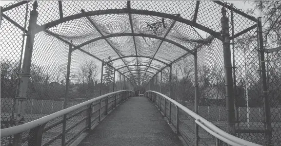  ?? PHOTOS: BRUCE DEACHMAN ?? Time, wind, rain and snow have chipped away at the Harmer Avenue pedestrian bridge since it opened in 1963. It’s slated to be torn down within weeks.