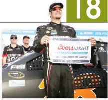  ??  ?? POLE WINNER: Martin Truex Jr, driver of the #78 Furniture Row Toyota, poses with the Coors Light Pole Award after qualifying for the NASCAR Sprint Cup Series Pennsylvan­ia 400 at Pocono Raceway on Friday in Long Pond, Pennsylvan­ia. (AFP)