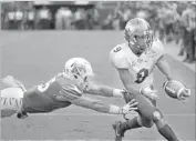  ?? John Raoux Associated Press ?? UCF’S Adrian Killins Jr. runs for a touchdown against Memphis in the AAC championsh­ip game.