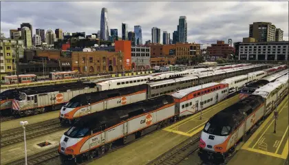  ?? NOAH BERGER — THE ASSOCIATED PRESS ?? During the peak of commute hours, Caltrain cars sit dormant at San Francisco’s Fourth and King Street station on March 30.