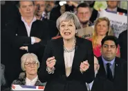  ?? AP/ANDREW YATES ?? Prime Minister Theresa May delivers a speech Wednesday in Walmsley Parish Hall in Bolton, England, as she asked voters for the mandate to lead post-Brexit Britain.