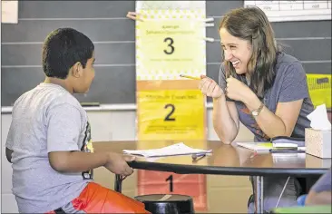  ?? RALPH BARRERA / AMERICAN-STATESMAN ?? Third-grade instructor Rachael Schardon teaches reading and writing to students at Pleasant Hill Elementary. Texas Education Commission­er Michael Williams has repeatedly said he is not changing his position on allowing local school districts to choose...