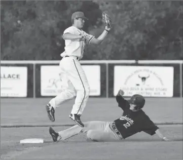  ?? Photo by Steven Mah ?? The Saskatoon Yellow Jackets stole their league leading 51st and 52nd bases during a 10-7 win over the Indians last Thursday.