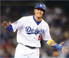  ?? (Reuters) ?? FEW PEOPLE in the sports world are as happy as Manny Machado is this week after he agreed to a 10-year, $300-million contract with the San Diego Padres, the highest price ever paid for a free agent in any American sport.