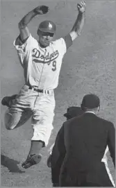  ?? Art Rogers Los Angeles Times ?? A CROWD FAVORITE Wally Moon slides into third base in Game 5 of the 1959 World Series against the Chicago White Sox.