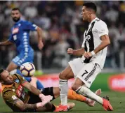  ?? AFP ?? Napoli’s Colombian goalkeeper David Ospina ( left) defends against Juventus forward Cristiano Ronaldo during their Italian league match at the Juventus stadium in Turin on Saturday. —