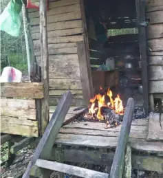  ??  ?? Rubbish being burnt at the entrance of the hut.