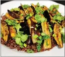  ?? ?? Red quinoa lends heft to roasted eggplant flavored with chile crisp.