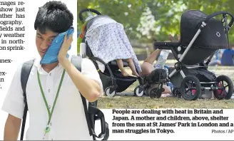  ?? Photos / AP ?? People are dealing with heat in Britain and Japan. A mother and children, above, shelter from the sun at St James' Park in London and a man struggles in Tokyo.