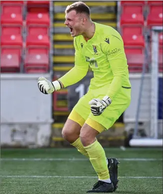  ?? ?? Hero Kelby Mason celebrates after making the penalty save which saw Tranent win the Lowland League Cup