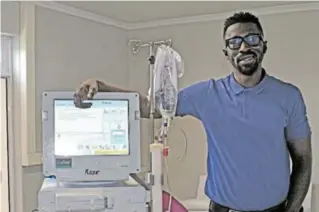  ??  ?? MAN AND MACHINE: Dr Thiecouta Traore, founder of GKRT, with ‘Rose’, one of the newlyinsta­lled renal therapy machines in the new Port Alfred branch of the company Picture: ROB KNOWLES