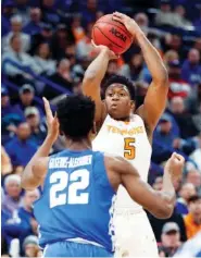  ?? ASSOCIATED PRESS FILE PHOTO ?? Tennessee forward Admiral Schofield shoots over Kentucky point guard Shai Gilgeous-Alexander, a former Hamilton Heights standout, during a game this past season. The Vols shared the SEC regular-season title with Auburn in 2018.