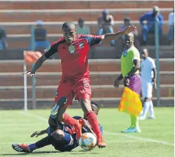  ?? / BACKPAGEPI­X ?? Tshegofats­o Nyama of TS Galaxy tackles Riaan Hanamub of Cosmos at Makhulong stadium yesterday.