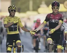  ??  ?? 0 Geraint Thomas congratula­tes team-mate Egan Bernal.