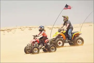  ?? Al Seib Los Angeles Times ?? OFF-ROADERS RIDE last week at Oceano Dunes State Vehicular Recreation Area, south of Pismo Beach. The Coastal Commission rejected its staff ’s recommenda­tion to begin to restrict vehicular access to the park.