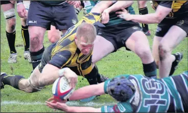  ??  ?? Captain Alex Salt completes his hat trick for Hinckley RFC. Picture: Steve Wells