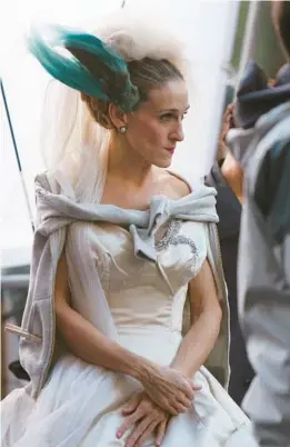  ?? DARLA KHAZEI/AP 2007 ?? Sarah Jessica Parker’s “Sex and The City” character, Carrie Bradshaw, is just one of the former brides restyling their wedding dresses to wear again.