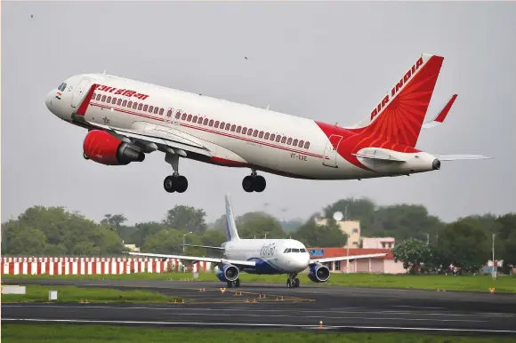  ??  ?? AN AIR INDIA aircraft takes off at the Sardar Vallabhbha­i Patel Internatio­nal Airport in Ahmedabad, India earlier this month.