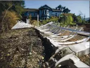  ?? ANDA CHU STAFF PHOTOGRAPH­ER ?? A melted plastic fence shows how close the wildfire came to Taylor Craig’s home in Vacaville. Craig says he had just a short time to load up horses and goats to evacuate before the fire came bearing down.