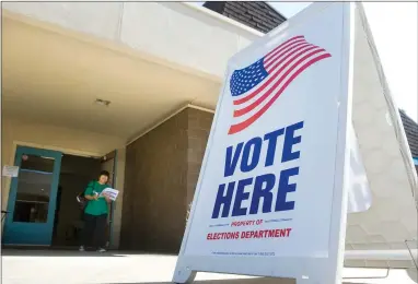  ?? RECORDER PHOTO BY CHIEKO HARA ?? A voter leaves First Christian Church, one of several Portervill­e polling places Tuesday, Nov. 6. California voters will choose the state’s next governor, lieutenant governor as well as local offices and measures.