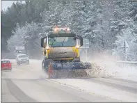  ??  ?? ROAD RISK: A snowplough works in the A9 south of Inverness.