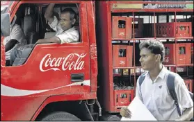  ?? RAJANISH KAKADE / ASSOCIATED PRESS 2012 ?? Traders have pulled iconic American brands Coke and Pepsi off their store shelves in south India in anger at PETA’s opposition to a local bull-taming sport.