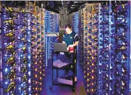  ??  ?? A technician works inside a cloud computer data center in The Dalles, Ore. Massive amounts of consumer data can be stored in such centers.