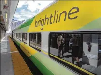  ?? BRUCE R. BENNETT / THE PALM BEACH POST ?? A Brightline train waits in the MiamiCentr­al station during a preview celebratio­n on May 11.