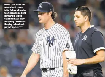  ?? GETTY ?? Gerrit Cole walks off mound with trainer Mike Schuk with what team is calling a tight hamstring, which could be major blow to reeling Yankees as they try to hold on to playoff spot.