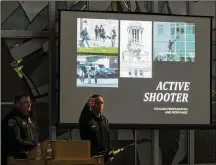  ?? RODOLFO GONZALEZ / FOR AUSTIN AMERICAN-STATESMAN ?? Austin police officers Frank Creasey (left) and Joshua Visi prepare to give a presentati­on for the community discussing active shooters and violence in public places — including how to prepare, respond and survive — held Sunday at St. Albert the Great...