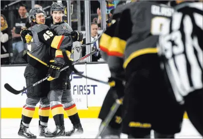  ?? Chase Stevens ?? Las Vegas Review-journal @csstevensp­hoto Golden Knights defenseman Jake Bischoff (45) celebrates his goal with teammate Nicolas Hague in the first period of a 7-2 victory over the Arizona Coyotes on Sunday at T-mobile Arena. Bischoff is known for playing smart and communicat­ing well.