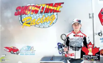  ?? DAVID CHERNISH/SPECIAL TO POSTMEDIA NETWORK ?? Hunter Bauer, 12, of Chippawa has been living up to his nickname Showtime with his checkered flags from flat-track motorcycle racing at Welland County Speedway.