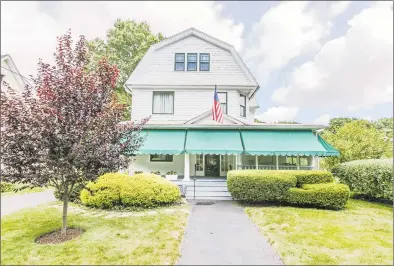  ?? Anna Guzzi / Contribute­d photos ?? The front of the four-bedroom colonial house at 38 Governors Ave. in Milford, which has been home to the Harrison family for at least 100 years.