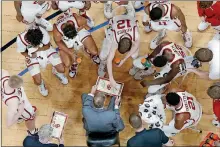  ?? [BRYAN TERRY/THE OKLAHOMAN] ?? Oklahoma coach Lon Kruger talks with his basketball team during a timeout on Saturday against Mississipp­i State at Chesapeake Energy Arena.