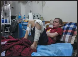  ?? ?? Mohamed Abu Rteinah, 12, who was hurt by a munition that struck his home in the city of Rafah, gets medical attention in the Gaza Strip in November. He has since been evacuated with his family to the United Arab Emirates.