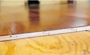  ??  ?? Engineered click flooring is one of the best options for installati­on in basements over a wood subfloor. The edges interlock, with no need for nails.