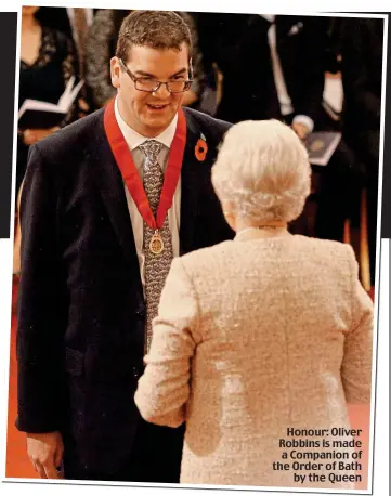  ??  ?? Honour: Oliver Robbins is made a Companion of the Order of Bath by the Queen