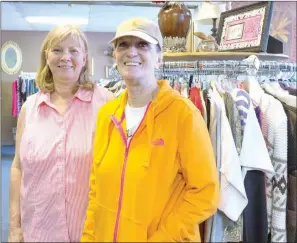  ?? ANGELA SPENCER/CONTRIBUTI­NG PHOTOGRAPH­ER ?? Janet Wilson, left, and Bonnie Johnson stand in the new Helping Hands & Caring Hearts Thrift Store in Jacksonvil­le at 515 S. James St.