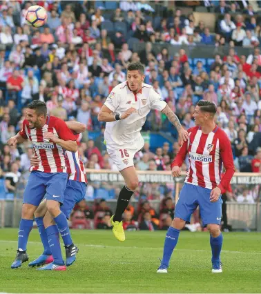  ??  ?? Challenger­s...Sevilla (in white) and Atletico Madrid