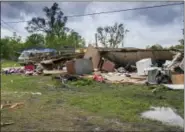  ?? LUCIUS FONTENOT — THE DAILY ADVERTISER VIA AP ?? The remains of a trailer lie where a woman and her 3-yearold daughter were killed during a severe storm, in Breaux Bridge, La., Sunday.