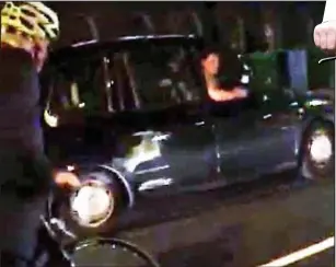  ??  ?? Caught on camera: The black-cab driver gestures to Boris Johnson