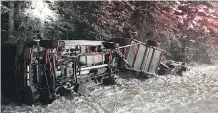  ?? IAN JARVIS /THE CANADIAN PRESS ?? Reuben and the Dark’s tour van and trailer sit tipped over after a crash near Field, B.C.