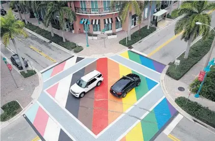  ?? AMY BETH BENNETT / SOUTH FLORIDA SUN SENTINEL ?? Skid marks are shown on the brand new LGBTQ-inspired streetscap­e at Northeast Second Avenue and Northeast First Street in Delray Beach on Wednesday.