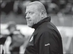  ?? NHAT V. MEYER/TRIBUNE NEWS SERVICE ?? Tom Cable, then the head coach of the Raiders, heads off the field following a loss in December of 2010. He is back with the Raiders this year as the offensive line coach.