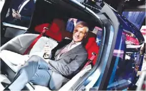  ??  ?? FRANKFURT: CEO of German carmaker Volkswagen (VW) Matthias Mueller poses for photograph­ers on a VW Sedric, the group’s first autonomous car prototype during a Volkswagen preview night for the media on the eve of the opening of the Internatio­nale...