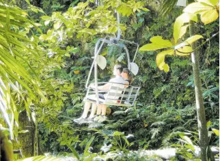  ?? FILE ?? Two cruise ship passengers ascending the Sky Explorer at Mystic Mountain in Ocho Rios, St Ann.