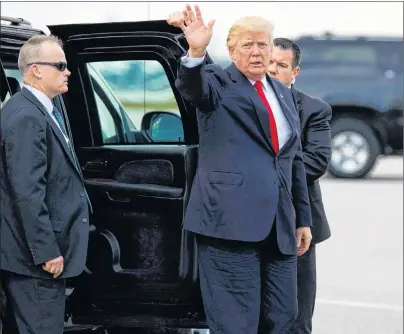  ?? AP PHOTO ?? U.S. President Donald Trump waves as he arrives to board Air Force One at Palm Beach Internatio­nal Airport Monday in West Palm Beach, Fla., to return to Washington.