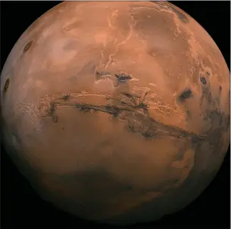  ?? NASA VIA AP ?? This composite was created from over 100 images of Mars taken by Viking Orbiters in the 1970s. In our solar system family, Mars is Earth’s next-of-kin, the next-door relative that has captivated humans for millennia.