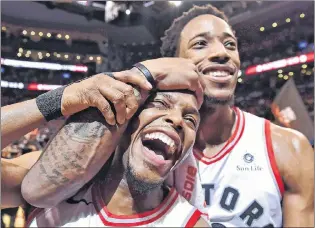  ?? CP PHOTO ?? Toronto Raptors’ Kyle Lowry, left, and Demar Derozan celebrate after defeating the Milwaukee Bucks in NBA action in Toronto on Monday, Jan. 1, 2018.